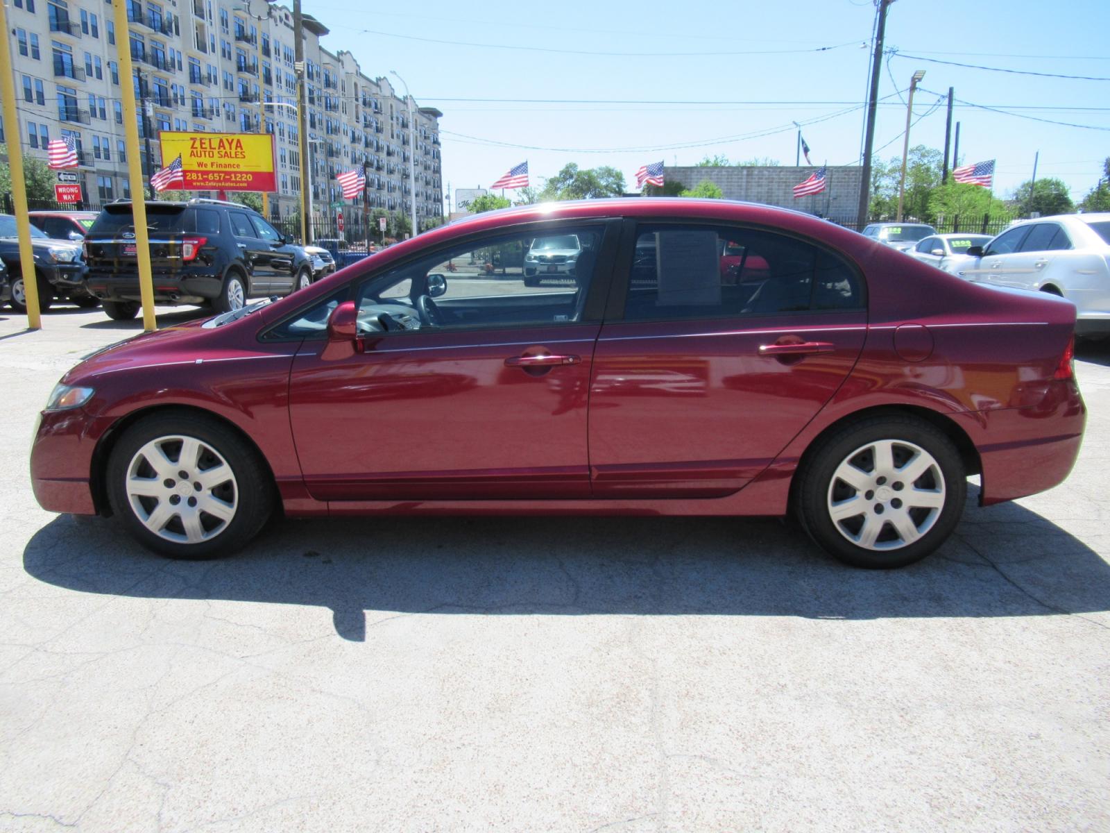 2009 Red /Tan Honda Civic LX Sedan AT (19XFA16529E) with an 1.8L L4 SOHC 16V engine, Automatic Overdrive transmission, located at 1511 North Shepherd Dr., Houston, TX, 77008, (281) 657-1221, 29.798361, -95.412560 - 2009 HONDA CIVIC LX VIN: 19XFA16529E042917 1 9 X F A 1 6 5 2 9 E 0 4 2 9 1 7 SEDAN 4 DR 1.8L I4 F SOHC 16V GASOLINE FRONT WHEEL DRIVE - Photo #21